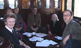 committee members at a society meeting
