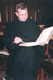 one of the monks seated on a Pugin designed chair
